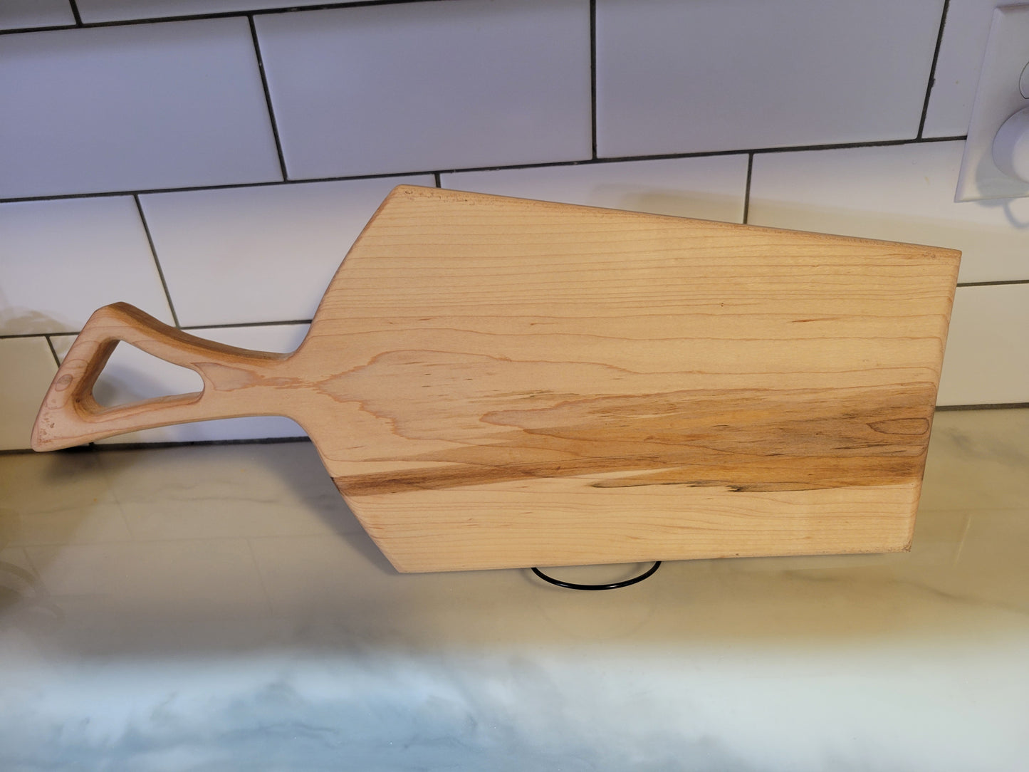 Light color maple charcuterie board with handle. boarderie