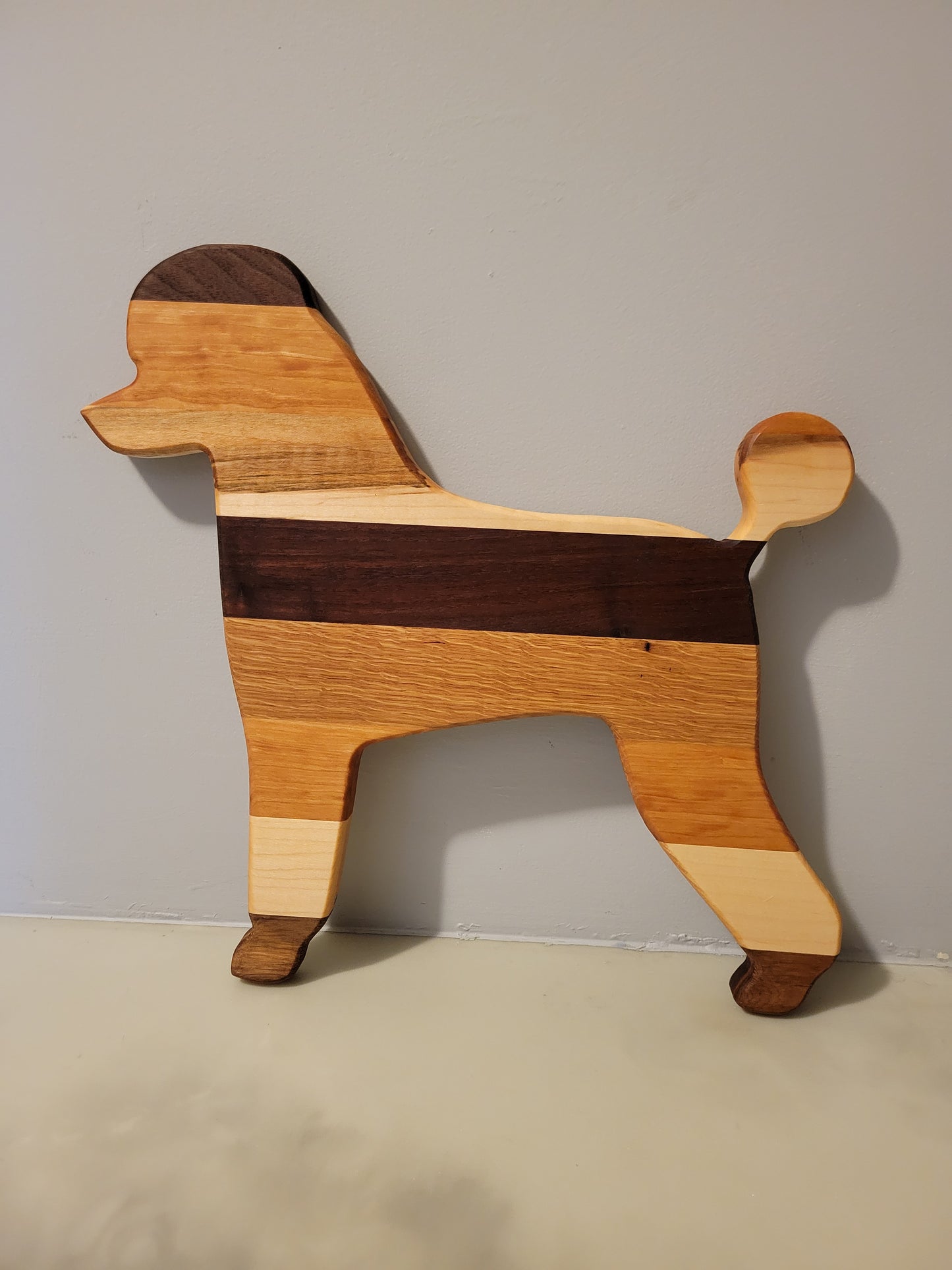 Poodle charcuterie board handmade with oak, walnut, maple and cherry.