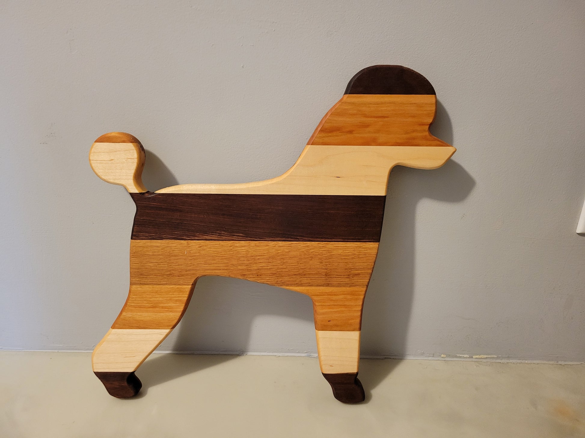 Poodle Dog charcuterie board handmade with oak, walnut, maple and cherry.