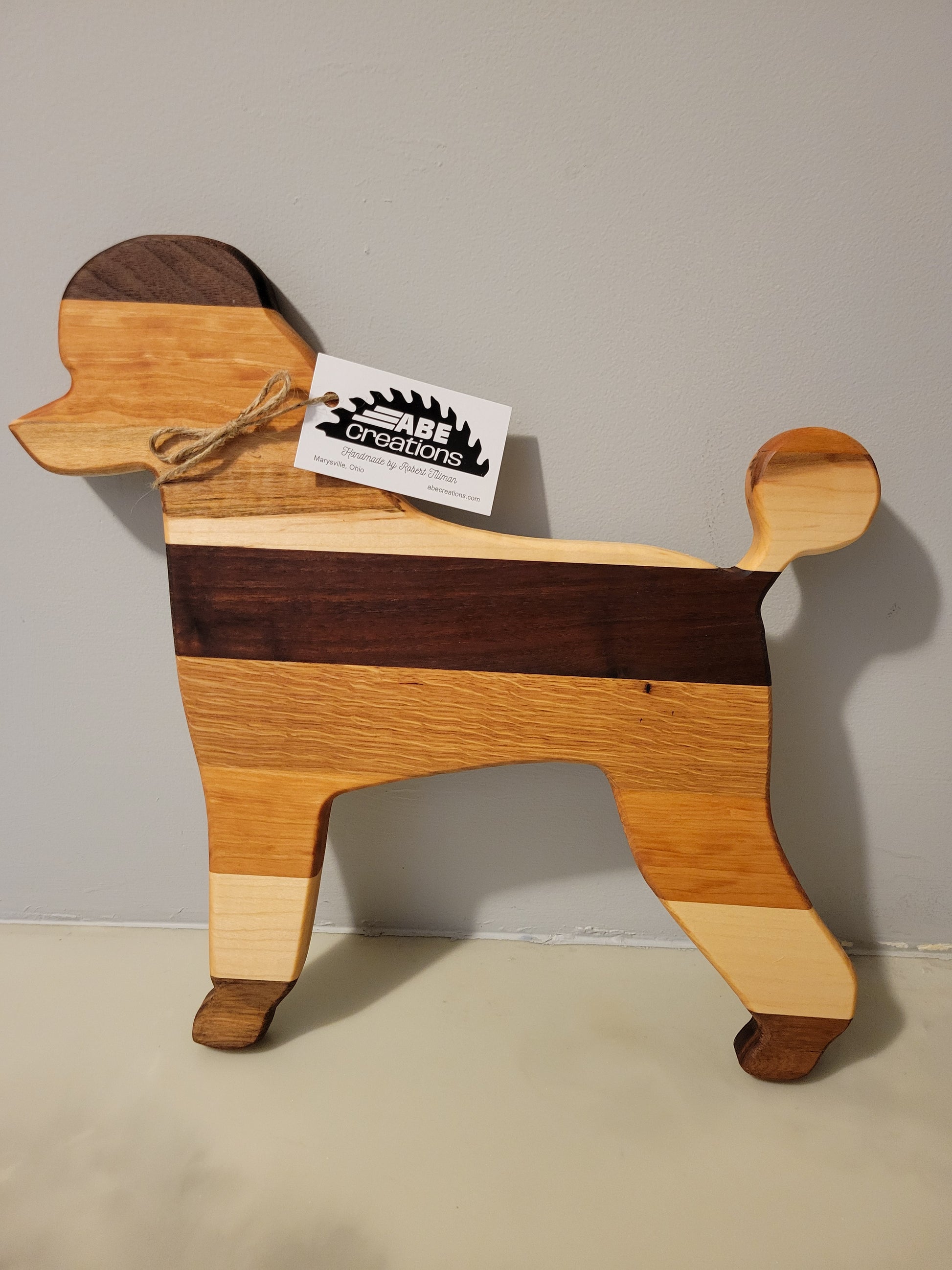 Poodle charcuterie board handmade with oak, walnut, maple and cherry.