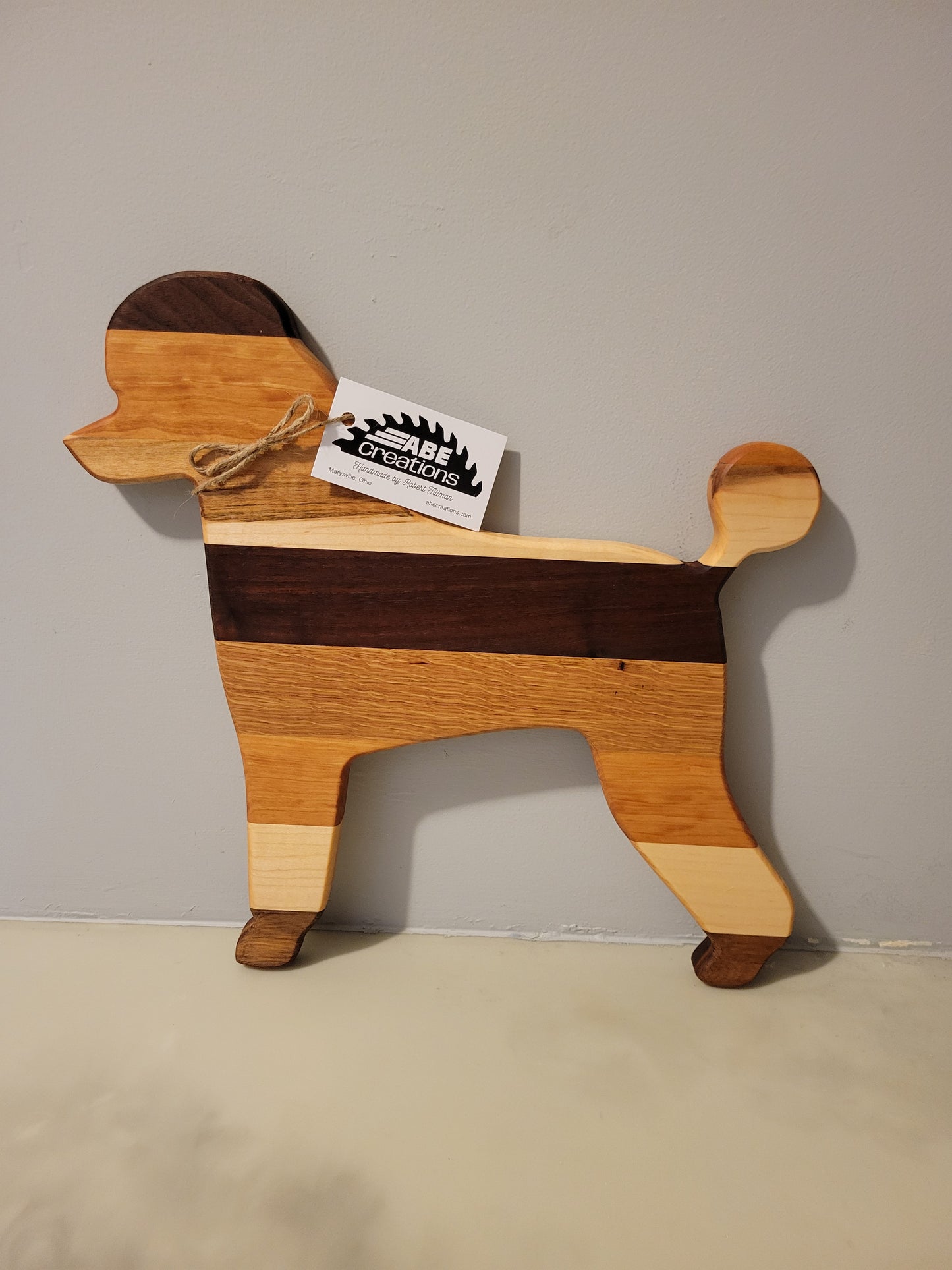 Poodle Dog charcuterie board handmade with oak, walnut, maple and cherry.