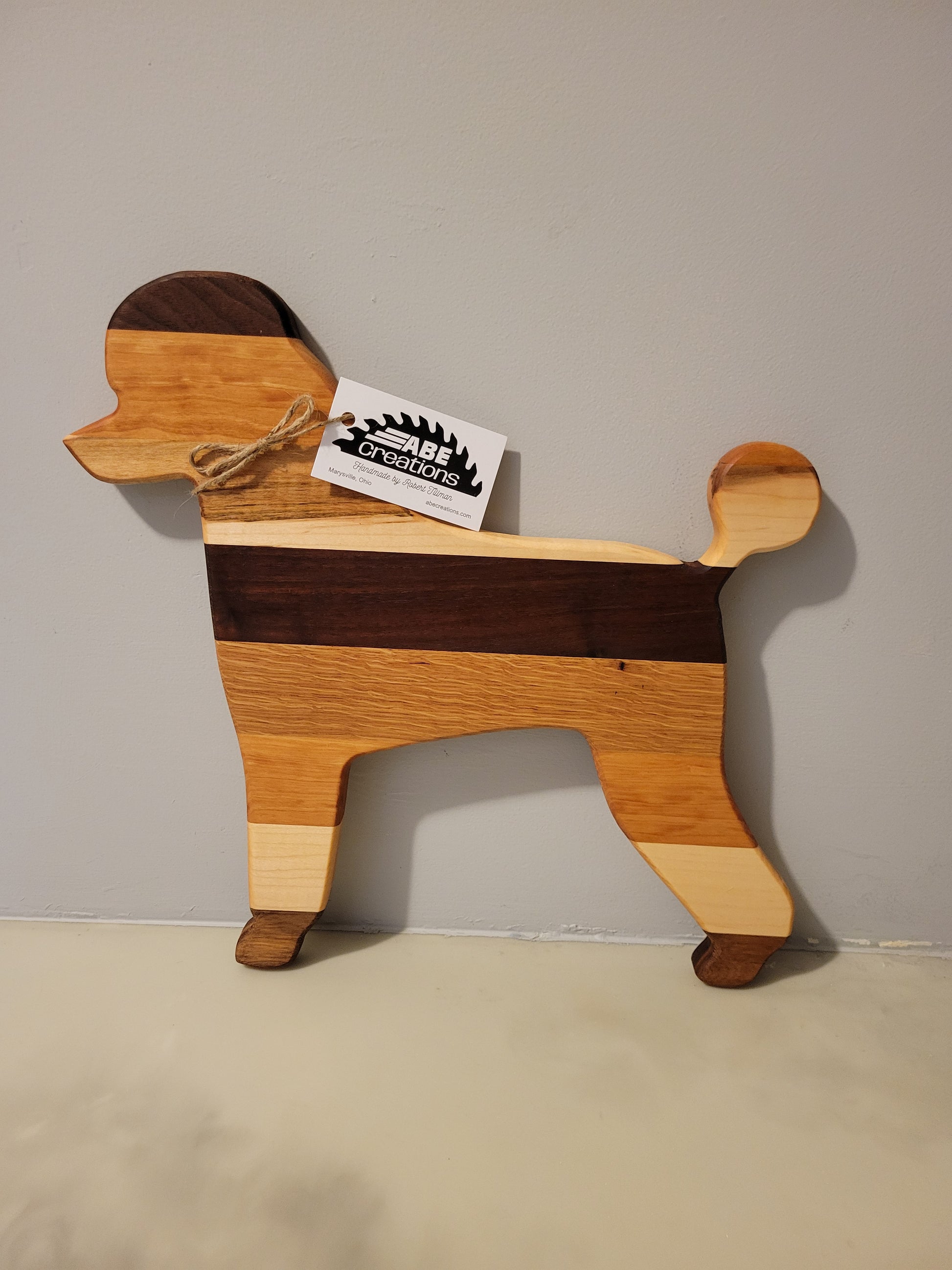 Poodle Dog charcuterie board handmade with oak, walnut, maple and cherry.