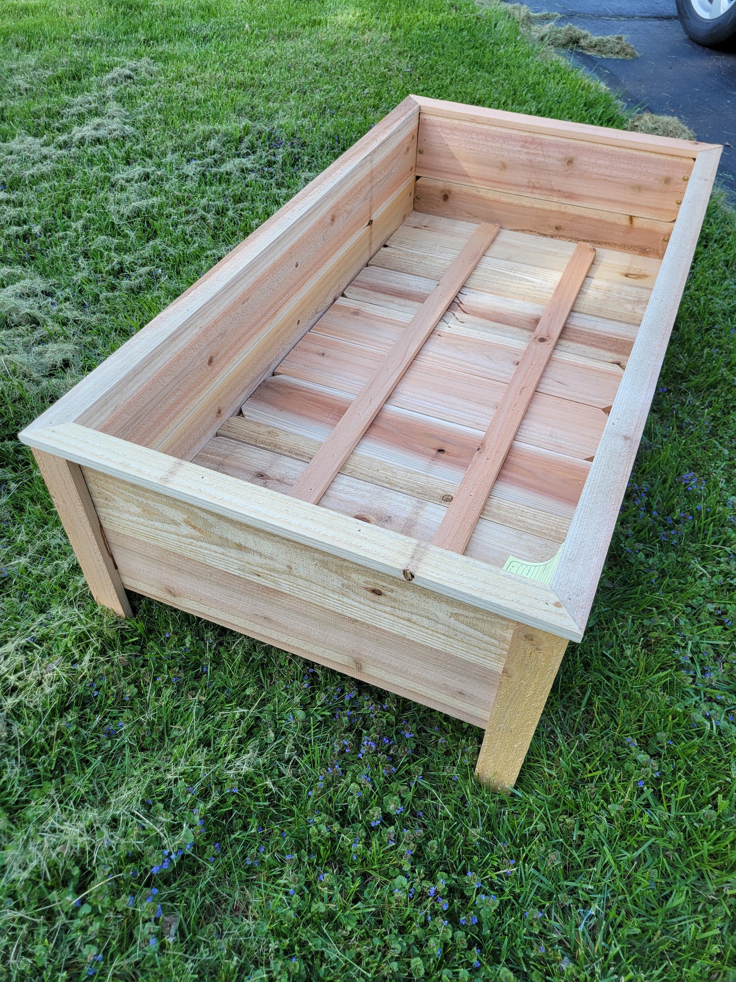 Wooden garden bed on grass
