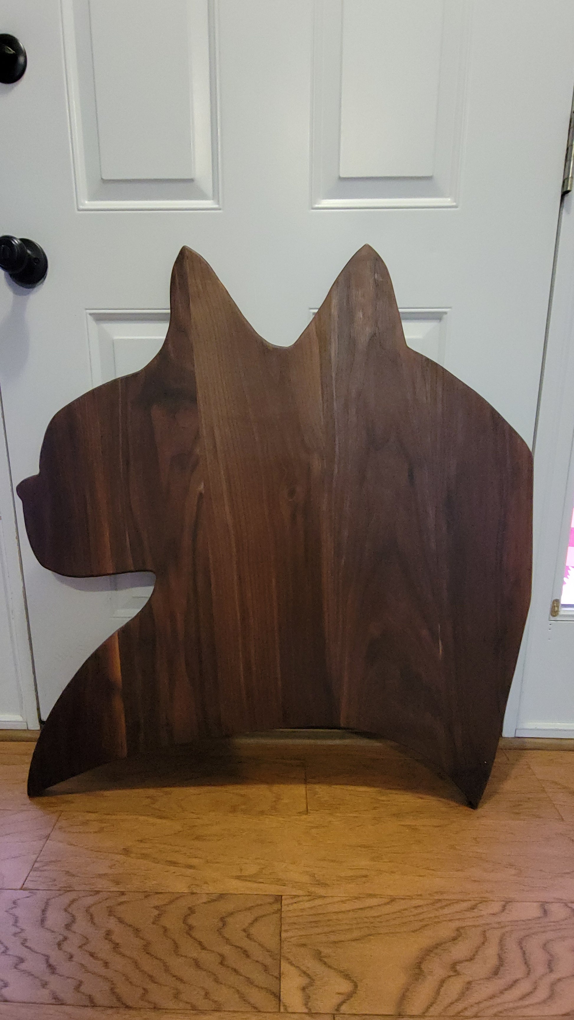 Giant Cat Head silhouette Charcuterie, Animal, foodie made from Walnut next to door.
