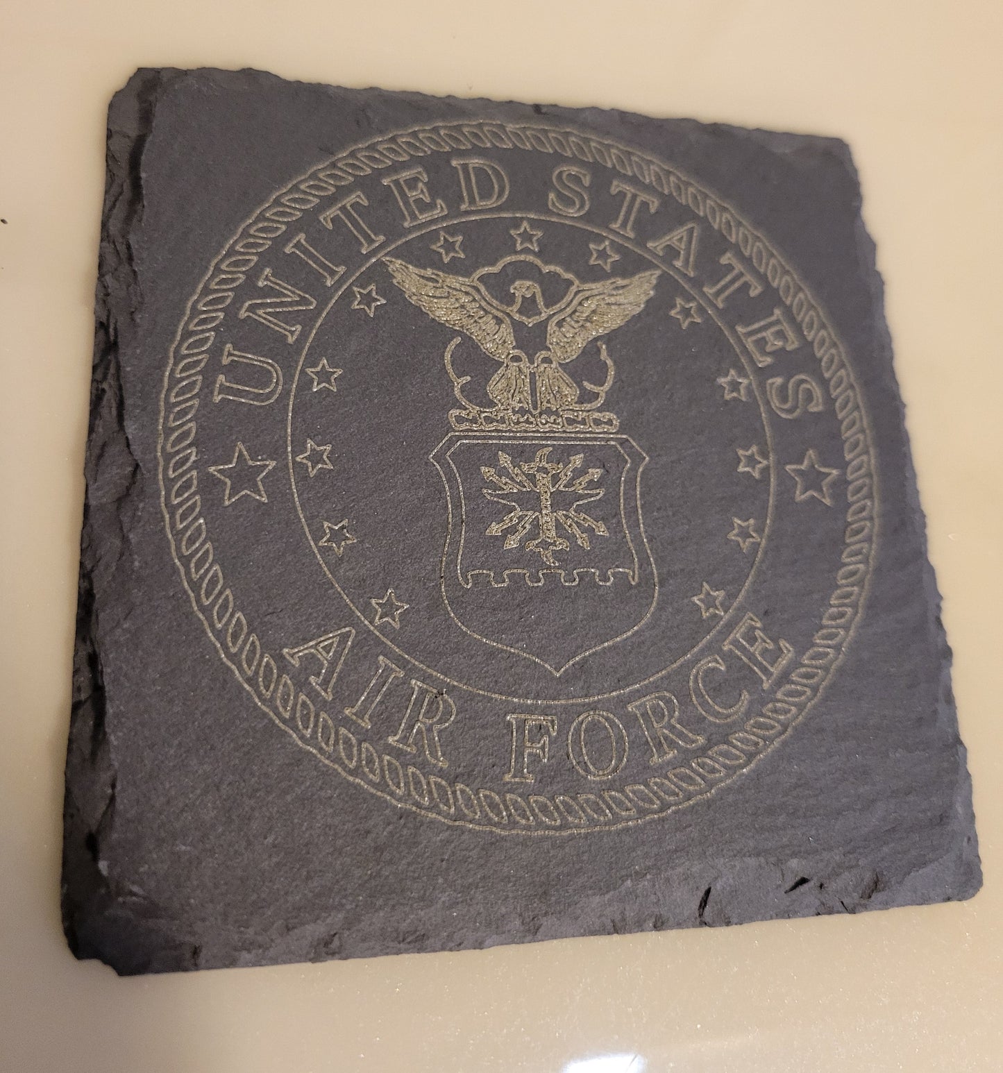 Slate coaster with engraved United States Air Force logo.