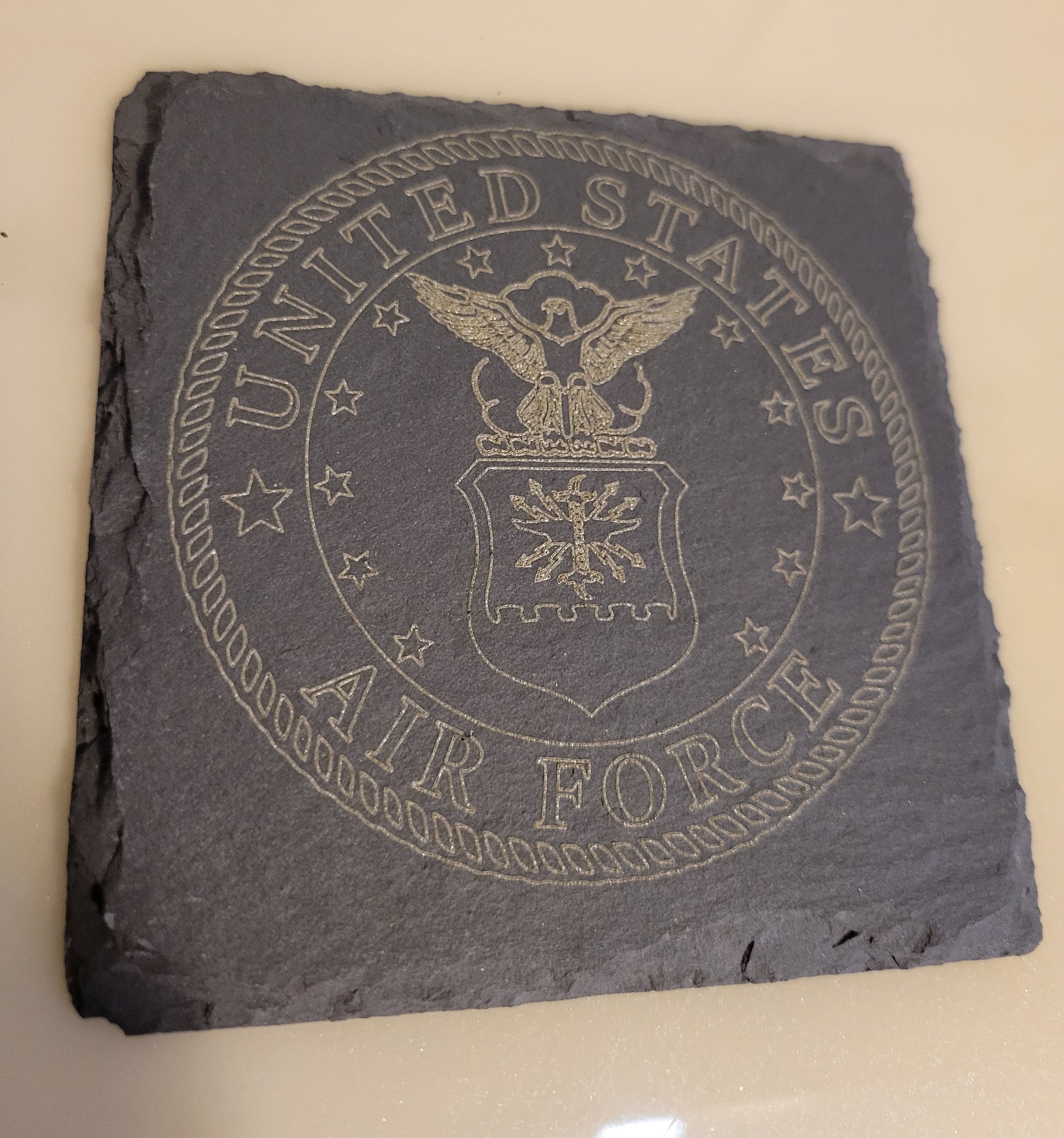 Slate coaster with engraved United States Air Force logo.