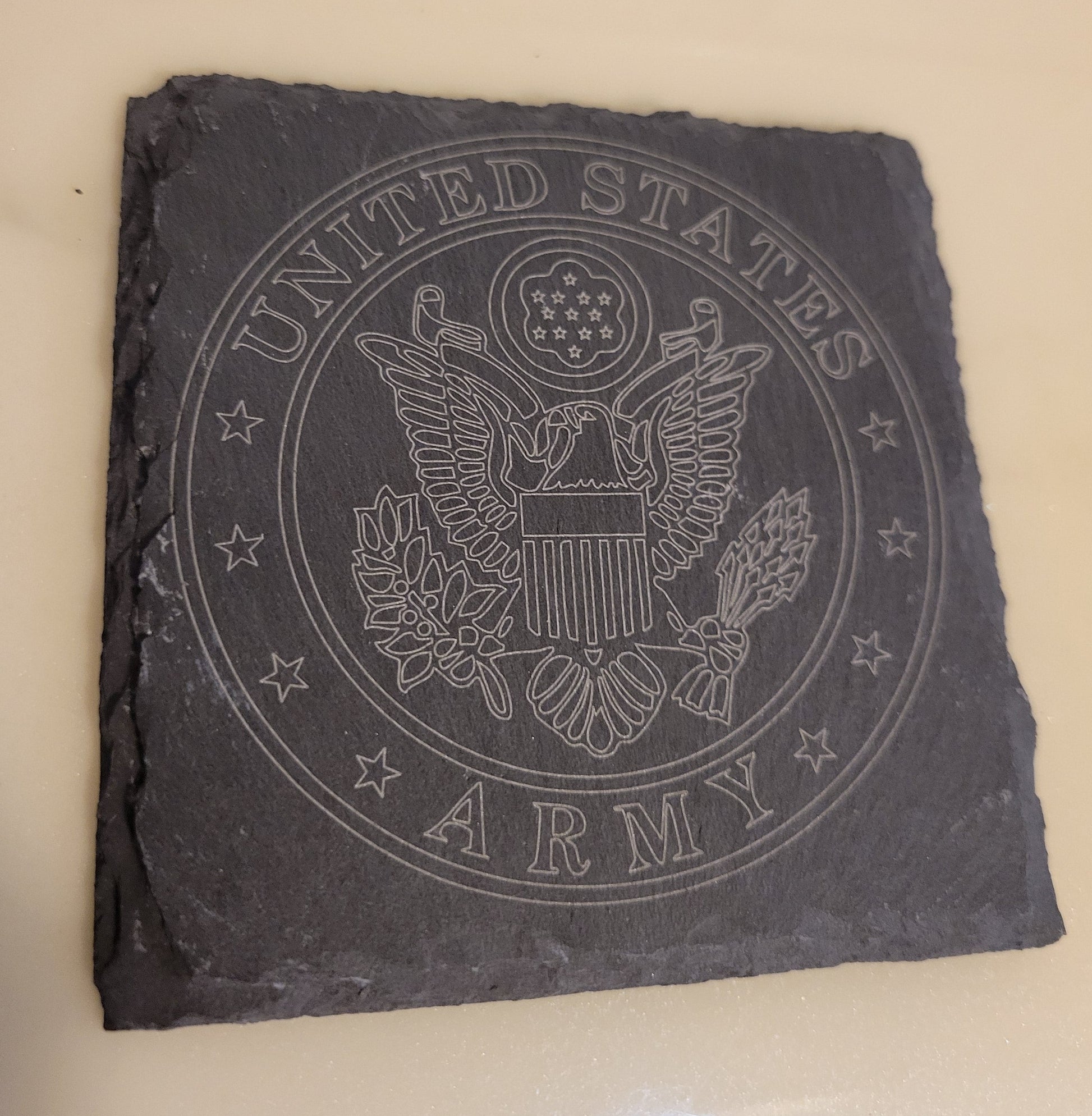 Slate coaster with engraved United States Army logo.